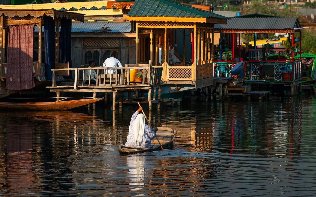 A woman rowing a shikara on Dal Lake