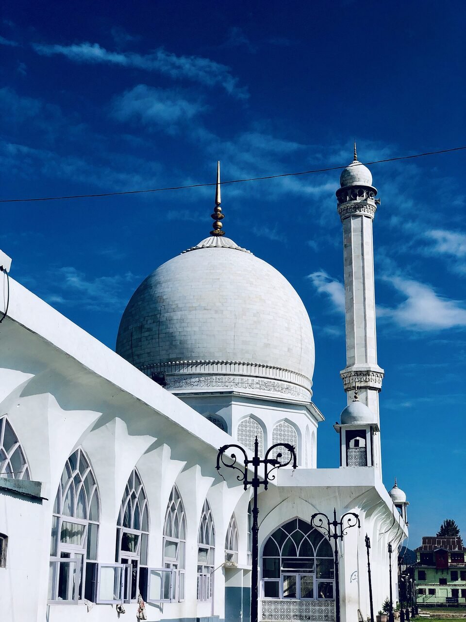 The white marble dome of Hazratbal shrine beside Dal Lake